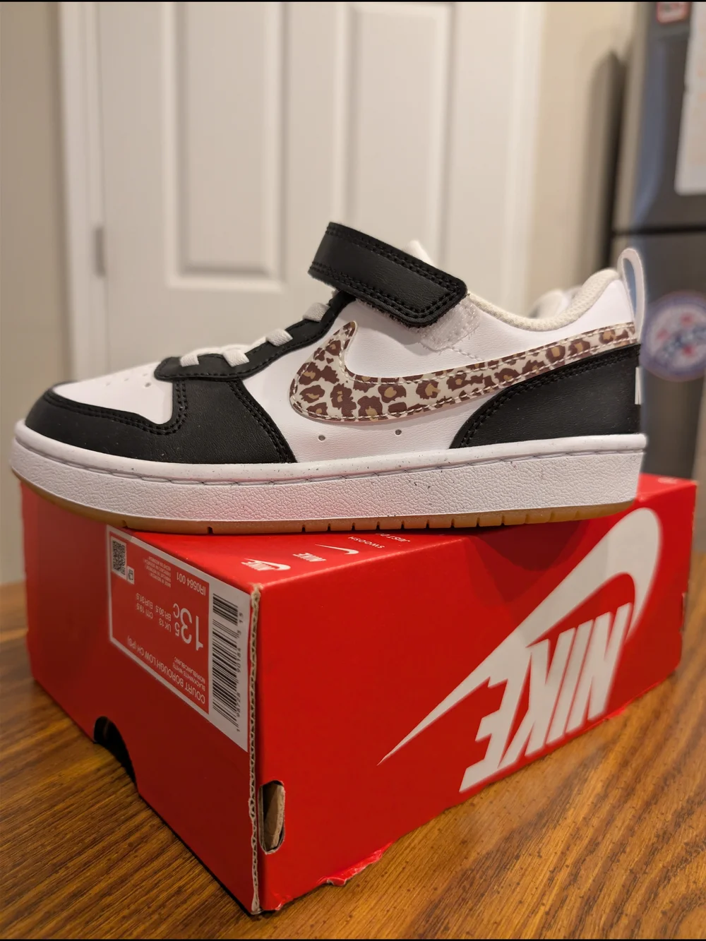 Nike Kids Court Borough Low-Top Sneaker in Black, White & Brown Leopard Swoosh